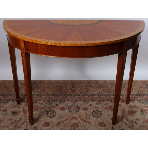 73 - A SHERATON DESIGN MAHOGANY AND SATINWOOD CROSSBANDED SIDE TABLE of demi lune outline the shaped top ... 