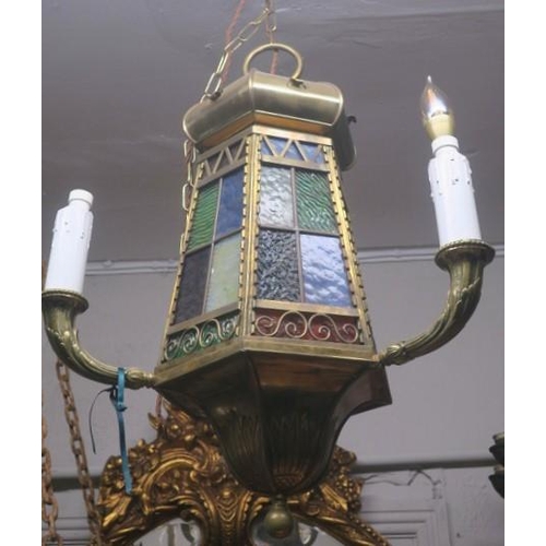 843 - A VINTAGE BRASS LEAD GLASS AND COLOURED GLASS THREE BRANCH LANTERN of octagonal spreading form with ... 