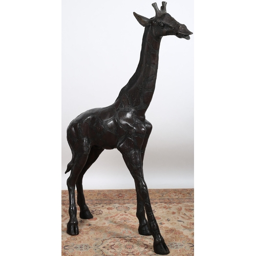 803 - A FINE BRONZE FIGURE modelled as a giraffe shown standing with head raised 
152cm (h) x 118cm (l)