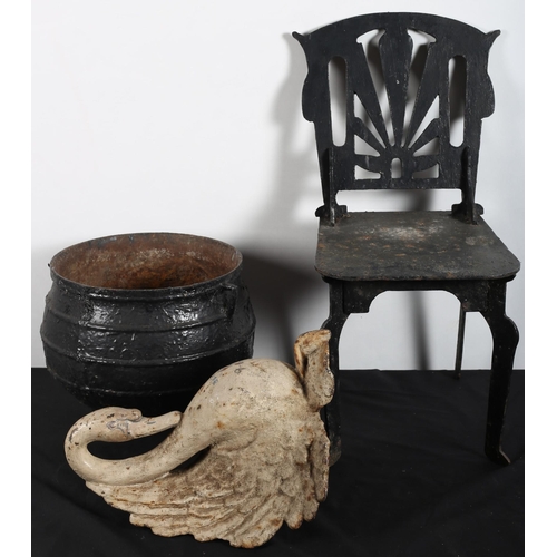 814 - A CAST IRON SKILLET, a cast iron figure modelled as a swan together with a cast iron miniature chair... 