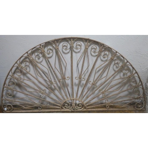 824 - A 19TH CENTURY WROUGHT IRON FAN LIGHT of demi lune outline with scroll decoration 
84cm (h) x 163cm ... 