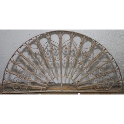 805 - A 19TH CENTURY WROUGHT IRON FAN LIGHT of demi lune outline with scroll decoration 
69cm (h) x 140cm ... 