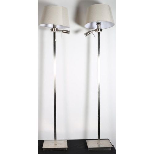 73 - A PAIR OF CONTEMPORARY CHROME FLOOR STANDARD LAMPS each with a square column above a moulded base wi... 