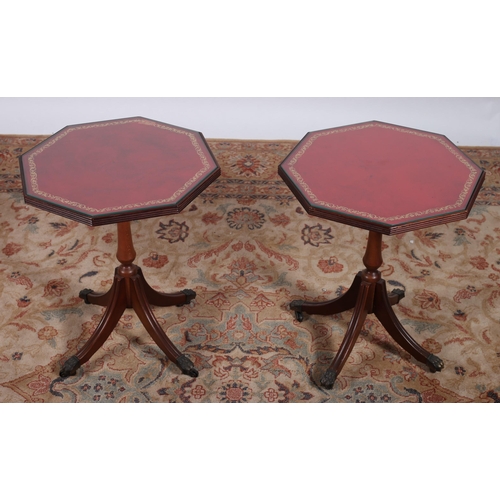 83 - A PAIR OF GEORGIAN DESIGN MAHOGANY WINE TABLES each of octagonal outline with tooled leather inset a... 