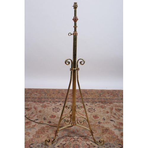 88 - A 19TH CENTURY BRASS AND COPPER TELESCOPIC STANDARD LAMP the cylindrical column with C-scroll decora... 