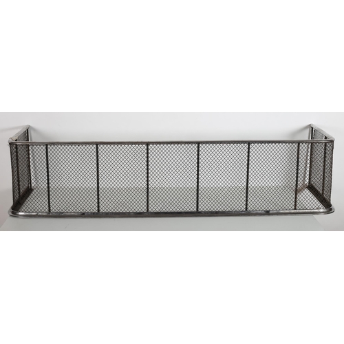 96 - A VINTAGE CHROME AND MESH FENDER raised on a stepped platform 30cm(h) x 130cm(w) x 34cm(d)