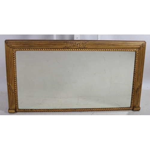 108 - A REGENCY GILTWOOD AND GESSO OVERMANTLE MIRROR the rectangular plate within a reeded and roped frame... 