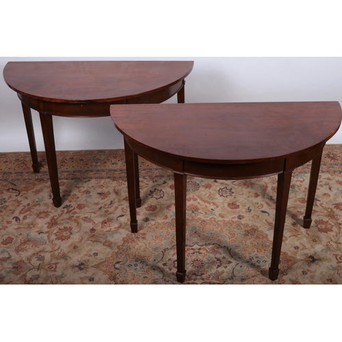 501 - A PAIR OF 19TH CENTURY MAHOGANY SIDE TABLES each of demi lune outline the shaped tops above a moulde... 