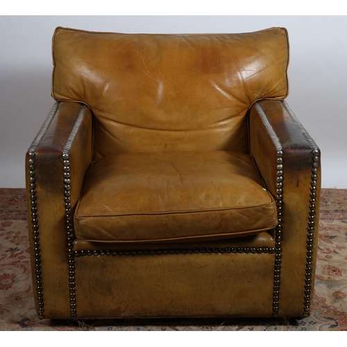 502 - A GOOD VINTAGE HIDE UPHOLSTERED CLUB ARMCHAIR the rectangular back with loose cushion and seat with ... 