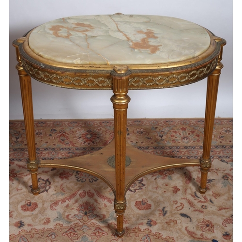 503 - A 19TH CENTURY GILTWOOD AND ONYX TABLE of oval outline with eared frieze containing a green veined o... 