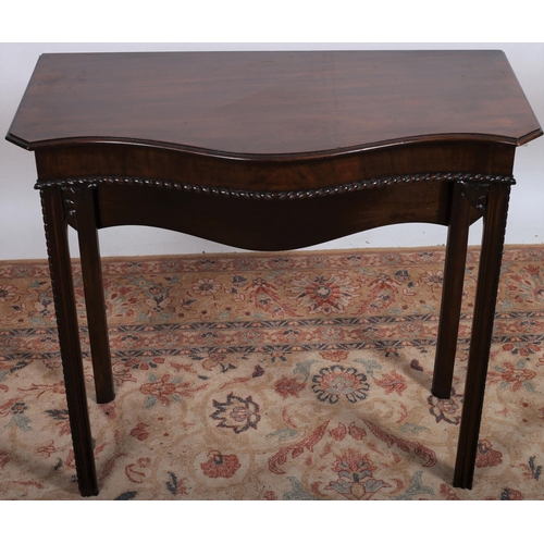 509 - AN EDWARDIAN MAHOGANY HEPPLEWHITE DESIGN SIDE TABLE of serpentine outline the shaped top with single... 