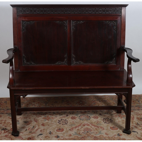 510 - A CHINESE CHIPPENDALE DESIGN MAHOGANY BENCH the blind fret top rail above a panelled back with appli... 