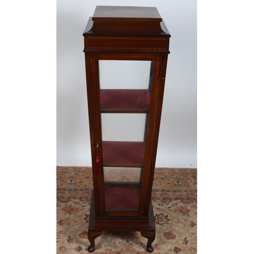 519 - AN EDWARDIAN MAHOGANY INLAID DISPLAY CABINET of square outline the shaped top with cavetto frieze ab... 