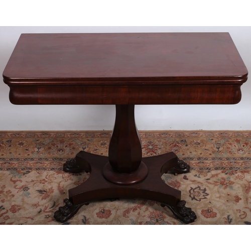 523 - A 19TH CENTURY MAHOGANY FOLDOVER SUPPER TABLE the rectangular hinged top above a faceted spreading c... 