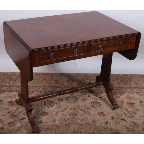 526 - A 19TH CENTURY REGENCY DESIGN SOFA TABLE the rectangular hinged top with reeded rim above two frieze... 