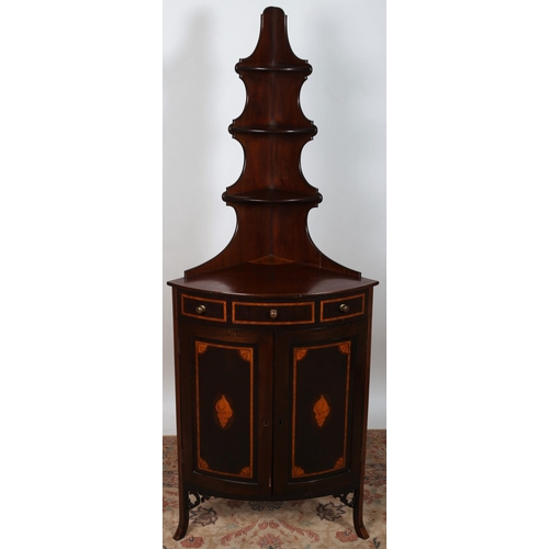 537 - AN EDWARDIAN MAHOGANY AND SATINWOOD INLAID CORNER CUPBOARD of demi lune outline the superstructure w... 