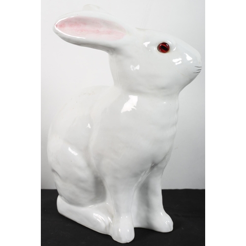 478 - AN ALCOBACA PORCELAIN FIGURE modelled as a rabbit white ground with pink ears and glazed eyes
27 cm ... 