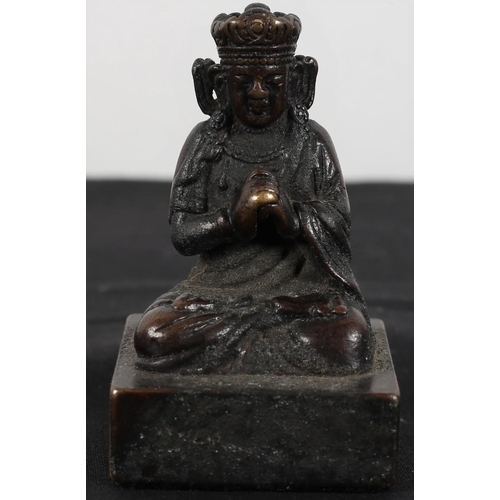 479 - A CHINESE BRONZE SEAL modelled as a Buddha shown seated raised on a square block seal base 
7 cm (h)