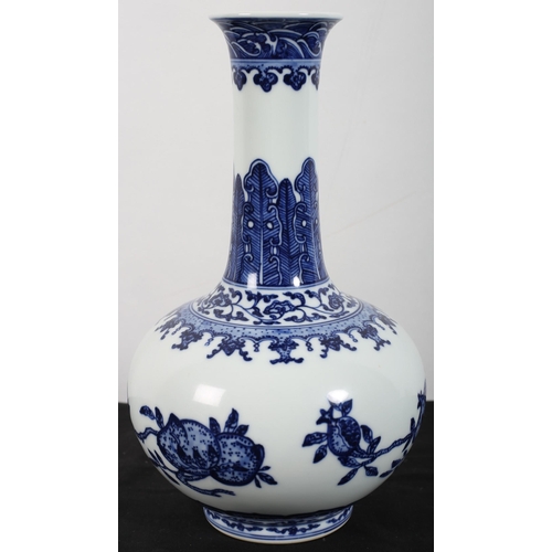 480 - A CHINESE BLUE AND WHITE VASE of baluster form the white and blue ground decorated with pomegranates... 