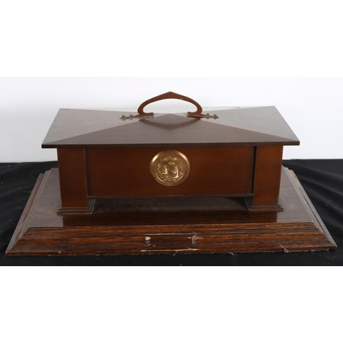 517 - A VINTAGE COPPER SCROLL CASKET of rectangular form with removable lid raised on stepped block feet w... 