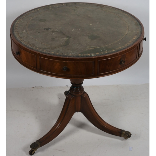 709 - A GEORGIAN DESIGN MAHOGANY DRUM TABLE the circular top with tooled leather inset with four true and ... 