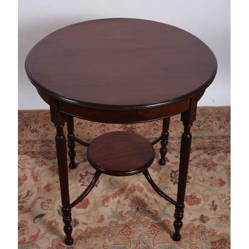 713 - A HEPPLEWHITE DESIGN MAHOGANY OCCASIONAL TABLE the circular moulded top on fluted and turned legs jo... 