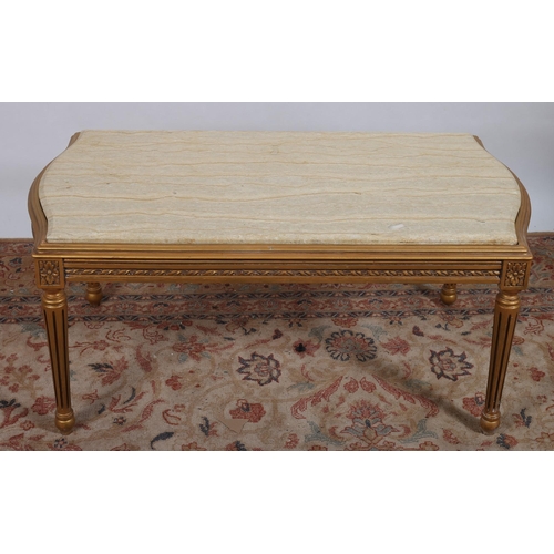 718 - A CONTINENTAL GILTWOOD COFFEE TABLE of rectangular bowed outline surmounted by a veined marble top o... 