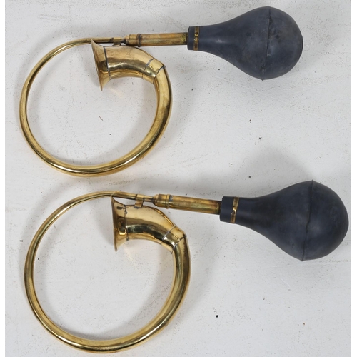 726 - A PAIR OF BRASS CAR HORNS of typical form