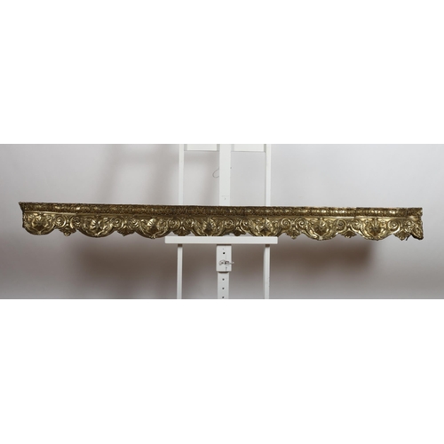 729 - A 19TH CENTURY EMBOSSED BRASS PELMET decorated with C-scrolls and stylised foliage 
17cm (h) x 216cm... 