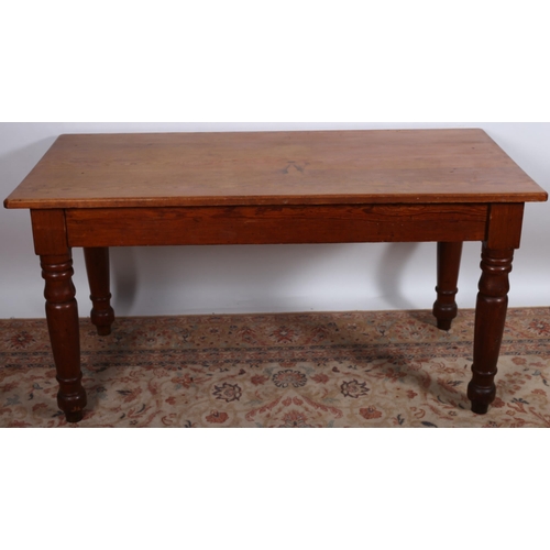 906 - A VINTAGE PINE BREAKFAST TABLE of rectangular outline the shaped top above a moulded apron on balust... 