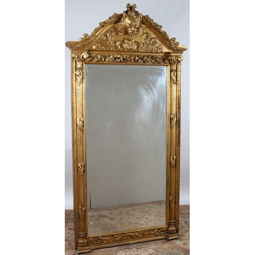 915 - A CONTINENTAL GILT FRAME MIRROR the rectangular bevelled glass plate within a reeded and foliate fra... 