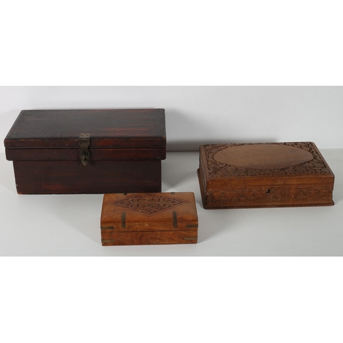 924 - A HARDWOOD CASKET of rectangular outline with hinged lid and metal clasp together with a carved wood... 