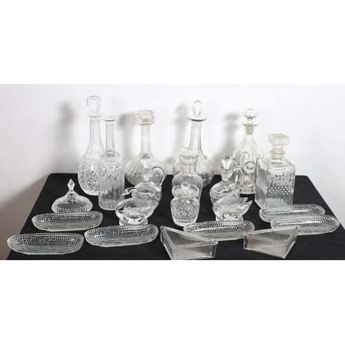 926 - A COLLECTION OF GLASSWARE to inlcude decanters etc. on two shelves