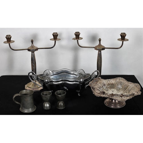 927 - A COLLECTION OF PLATED WARE to include a pair of two branch candelabra, a plated embossed swing hand... 