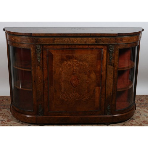 696 - A 19TH CENTURY BURR WALNUT SATINWOOD AND GILT BRASS MOUNTED SIDE CABINET of rectangular bowed outlin... 