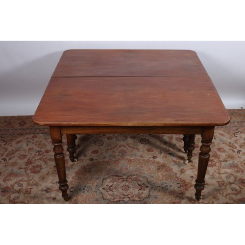 880 - A 19TH CENTURY MAHOGANY ECONOMY DINING TABLE of rectangular outline with rounded corners raised on e... 