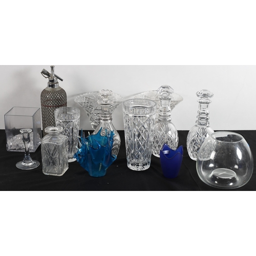 475 - TWO WATERFORD CUT GLASS VASES together with three cut glass decanters with stoppers, a soda syphon, ... 