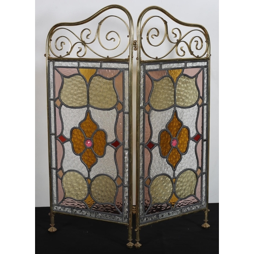 115 - A VINTAGE TWO FOLD BRASS, LEAD GLASS, CLEAR GLASS AND COLOURED GLASS FIRESCREEN of rectangular shape... 