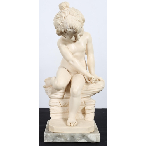 119 - A COMPOSITION FIGURE OF A YOUNG CHILD shown seated on a stone wall on marble plinth 32cm (h)