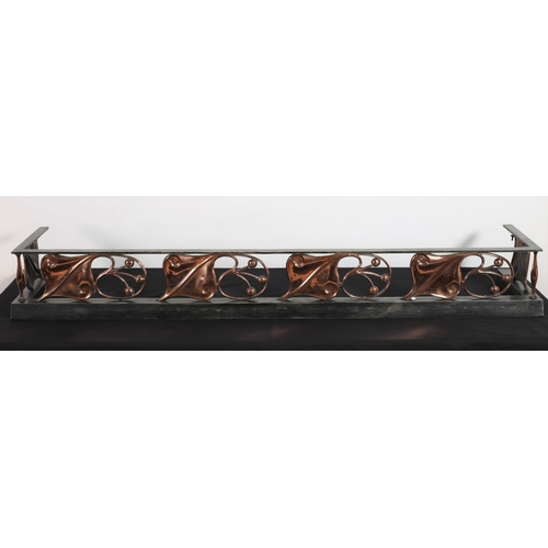 129 - AN ART NOUVEAU WHITE METAL AND COPPER FENDER the rectangular top rail above a platform base with sty... 