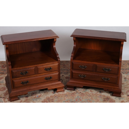 561 - A PAIR OF MAHOGANY BEDSIDE CHESTS each with a rectangular moulded top above an open compartment and ... 