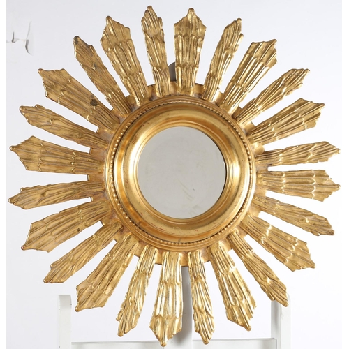 572 - A CONTINENTAL GILT FRAME SUN BURST MIRROR with circular bevelled glass plate 
72cm (d)