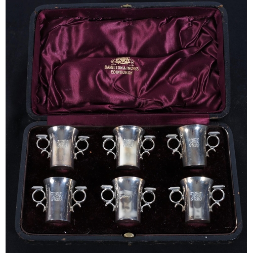 593 - A SET OF SIX SILVER TWO HANDLED CUPS in presentation case
London 1909