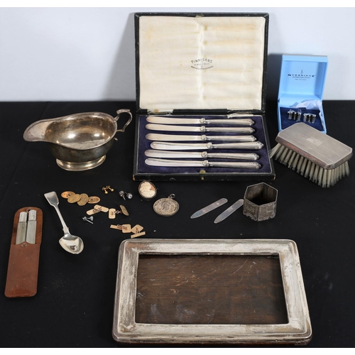 597 - A MISCELLANEOUS COLLECTION to include a set of six silver handle butter knives in case, a silver sau... 