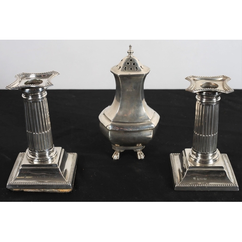 604 - A PAIR OF DESK CANDLESTICKS (AF) Birmingham, together with a silver sugar sifter (3)