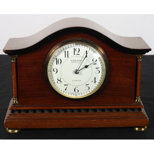 618 - A VINTAGE MAHOGANY CASED MANTLE CLOCK of architectural outline the shaped case with white dial inscr... 