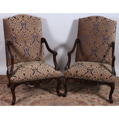 62 - A PAIR OF CONTINENTAL STAINED WOOD AND UPHOLSTERED ARMCHAIRS each with a rectangular shaped upholste... 