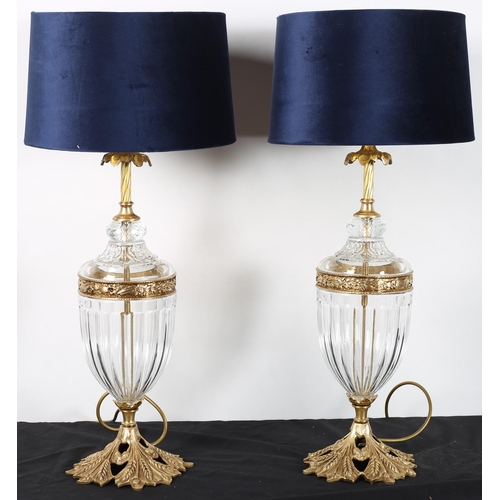 620 - A PAIR OF CONTINENTAL CUT GLASS AND GILT BRASS TABLE LAMPS each of urn form with foliate gilt brass ... 