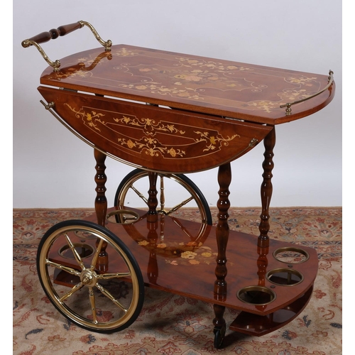 64 - A CONTINENTAL KINGWOOD MARQUETRY AND GILT BRASS MOUNTED TWO TIER DROP LEAF SERVING TROLLEY the oval ... 