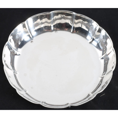 649 - AN IRISH SILVER DISH with scalloped rim Dublin 1966
12 cm diameter, 196 g